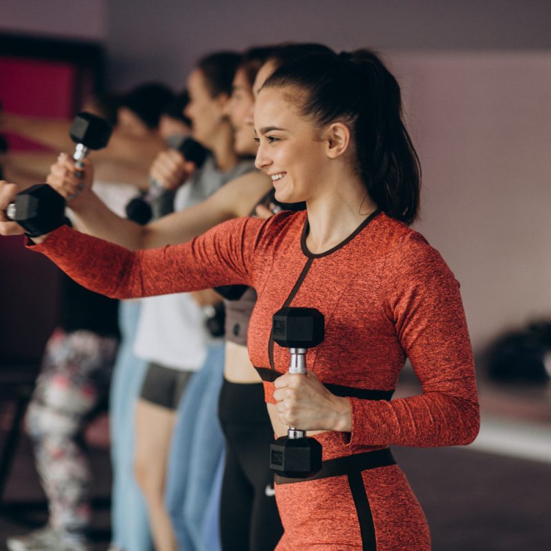 Woman exercising to lose weight with a personal trainer in nottingham