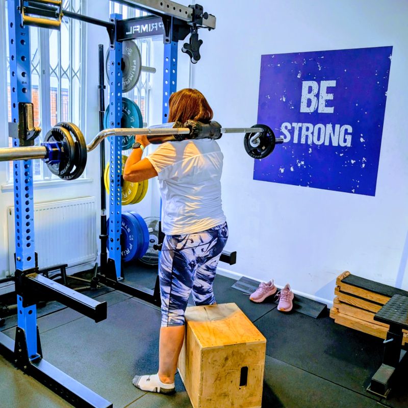 Jacquie learning the box squat