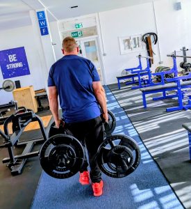 RWF Personal Training client Nick with a farmer's walk