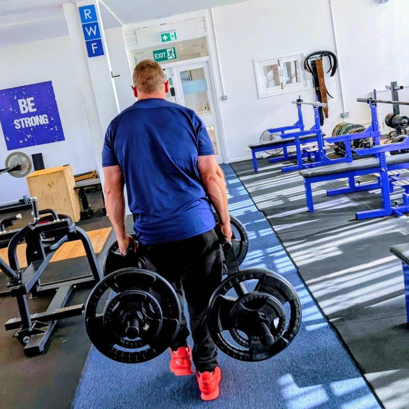 RWF Personal Training client Nick with a farmer's walk